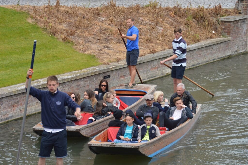 David Beckham and Victoria Beckham punting