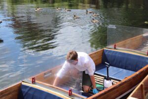 screen cleaning on a chauffeured punt in Cambridge