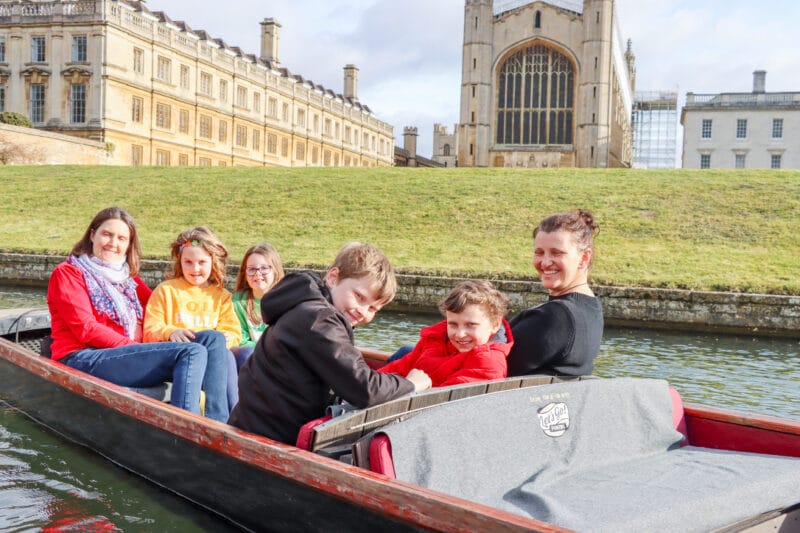Family enjoying a Mother's Day punt tour on the River Cam beside King's College Chapel