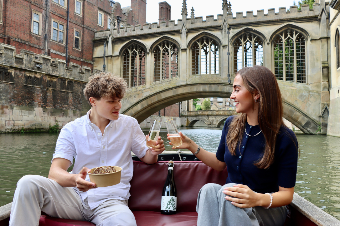 two people on river cam wine and cheese tasting