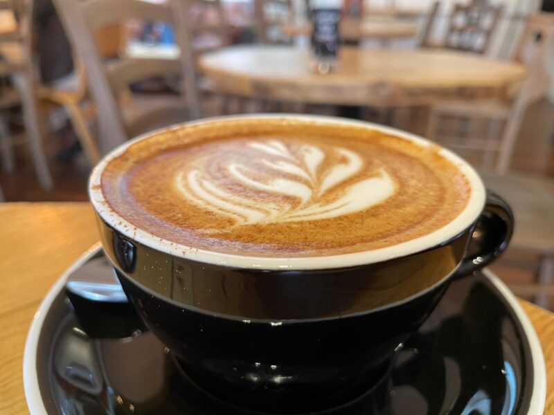 A latte with foam art in The Locker Cafe Cambridge.