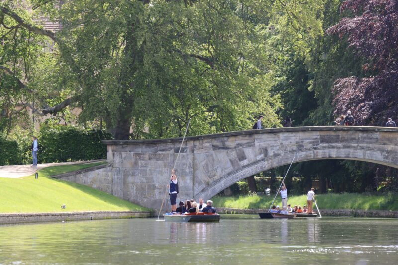 Punting in summer with Let's Go Punting beneath the stone King's College Bridge.