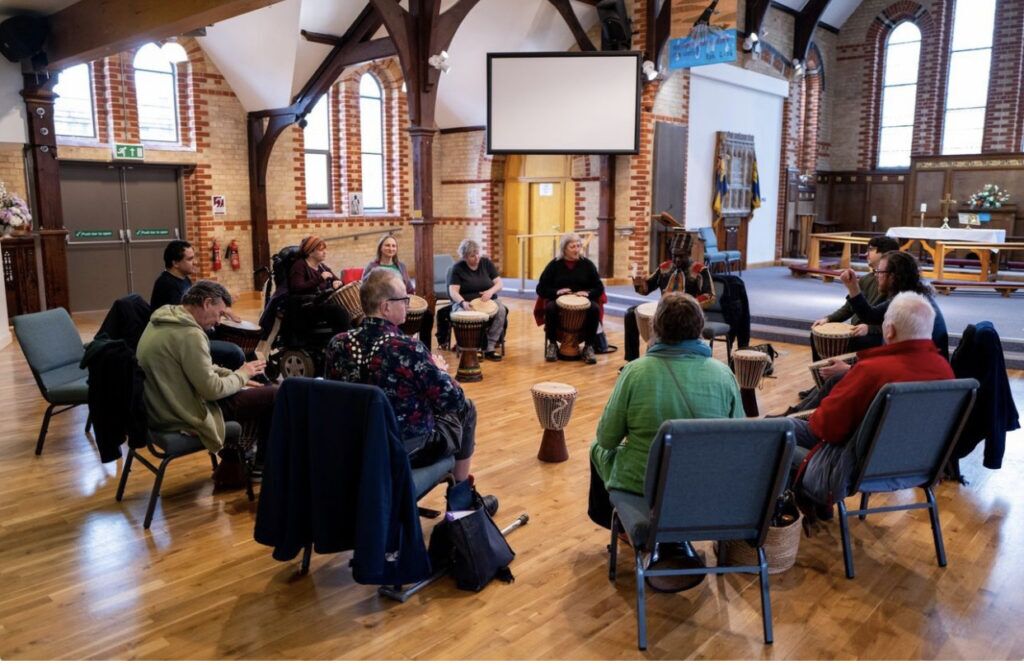 Happy members of the creative fenland project making music together