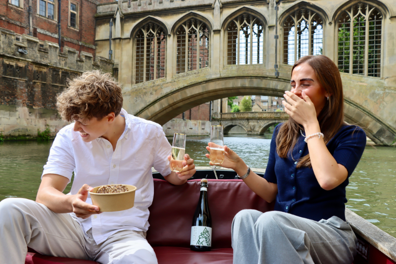 two people on river cam wine and cheese tasting