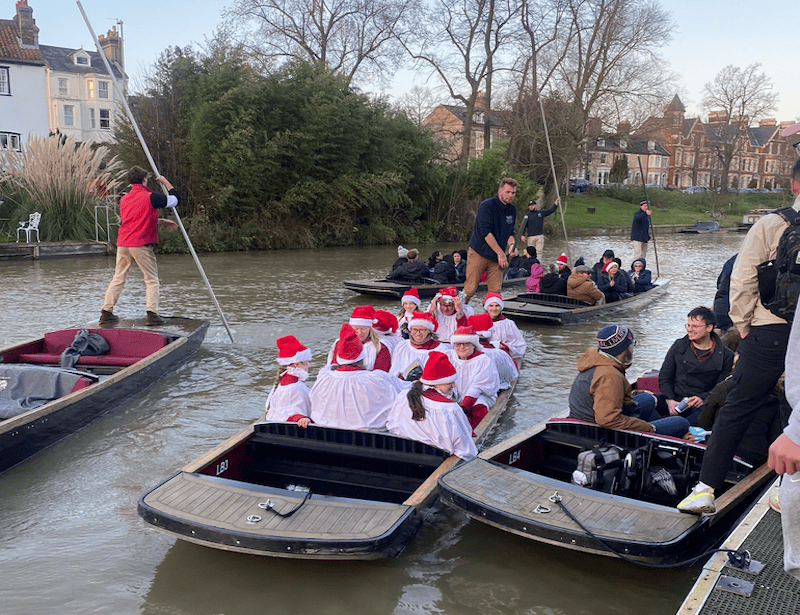 A very nice, beautiful shot of the punts full of christmas carolers and very happy punting patrons!