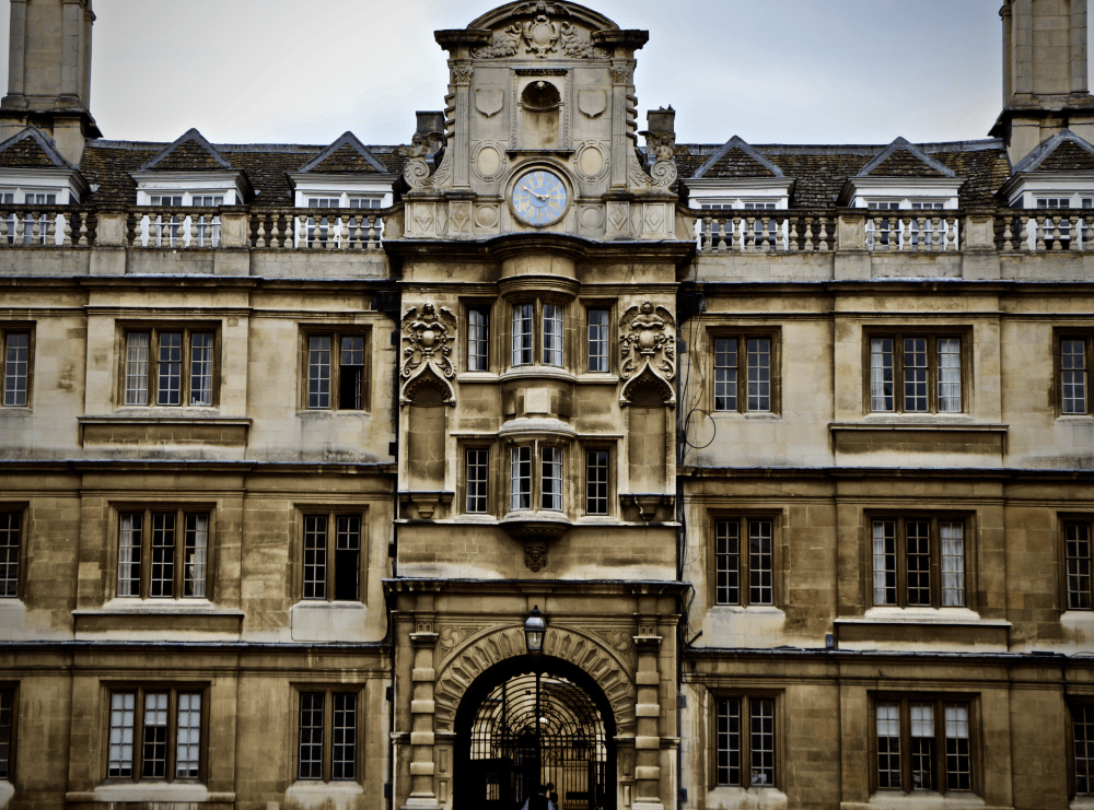 Ornate stone facade and clock of Clare College, Cambridge