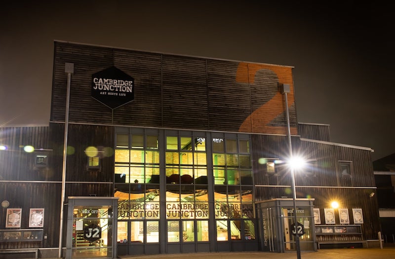 Cambridge Junction music and arts venue lit up at night.